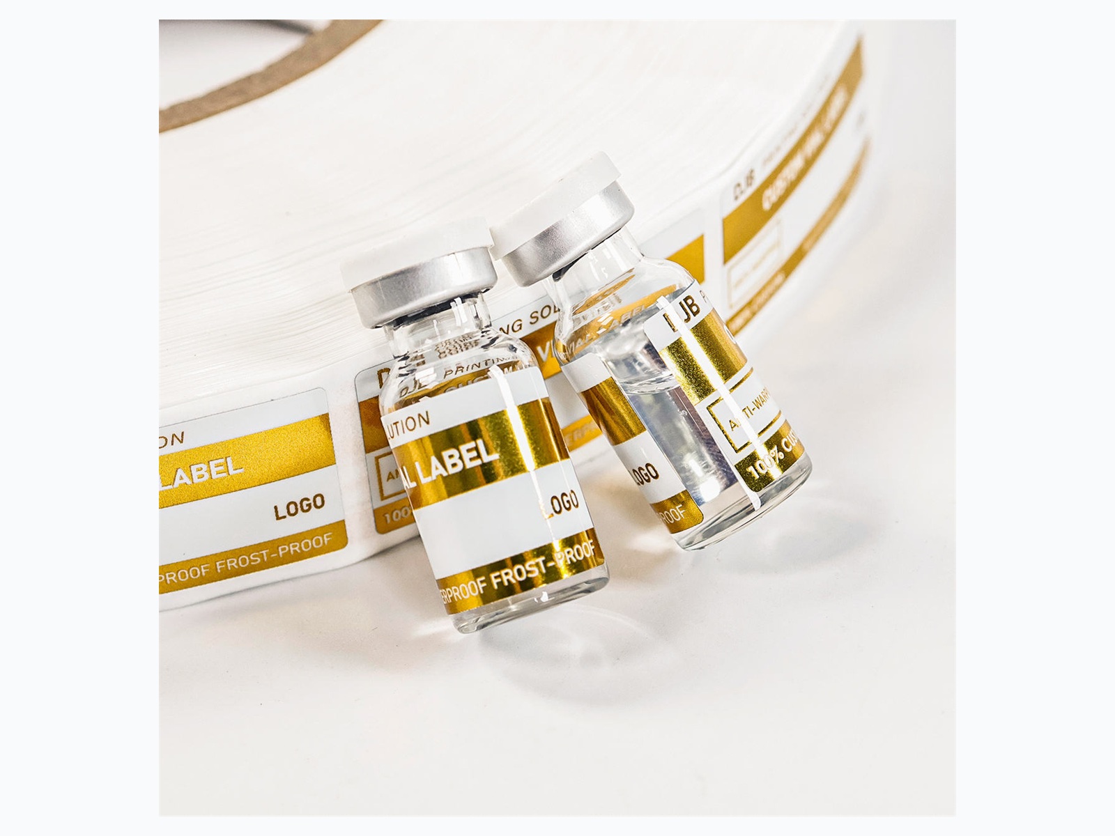 Gold foil vial roll labels and small bottle samples